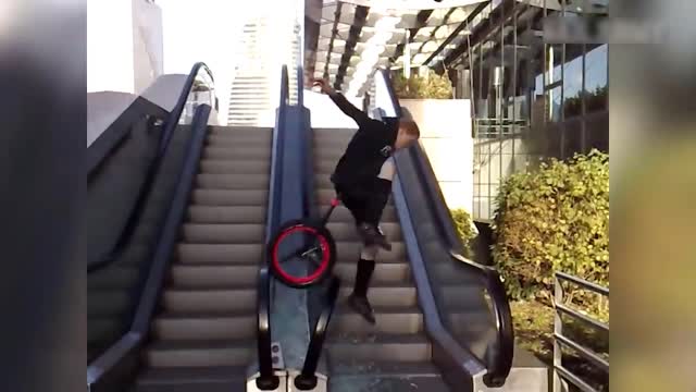 guy breaks escalator with bicycle