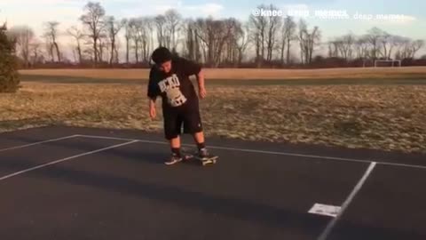 Big guy with afro tries to ride skateboard and does a split