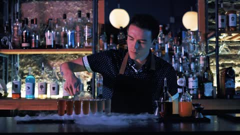 Bartender preparing shots