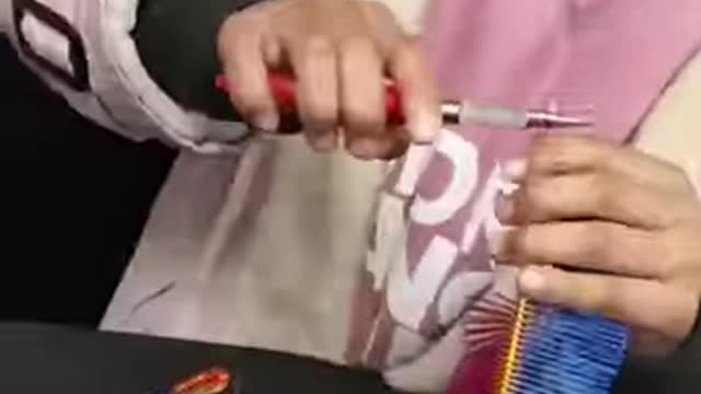 Watch this little girl make art with iron wires!