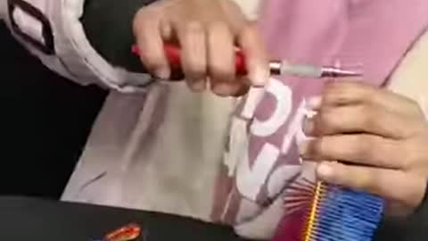 Watch this little girl make art with iron wires!