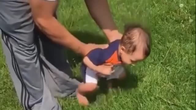 Drinking suspiciously on the grass.