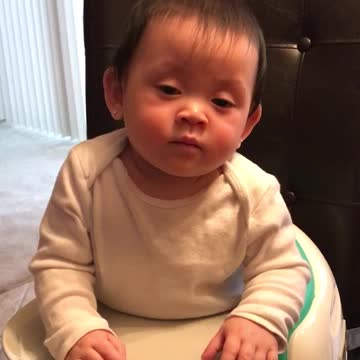 baby falling asleep at table