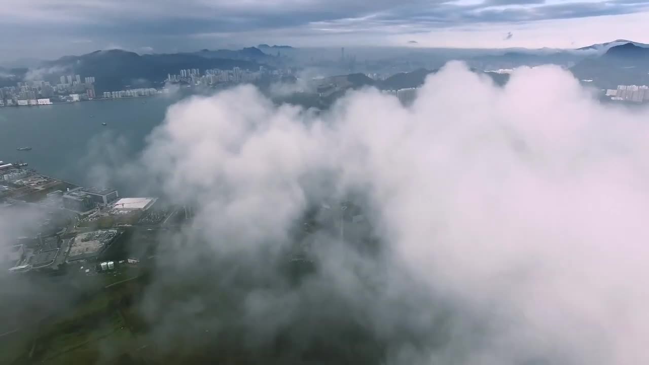 Drone in clouds with City view