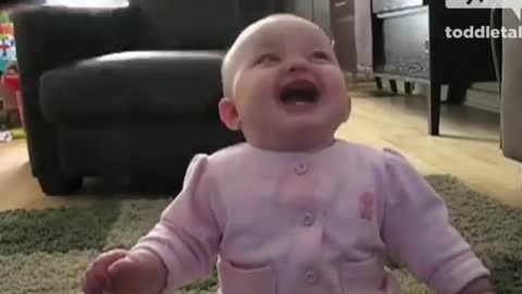 Cute baby, contagious laugh. Very funny!!