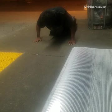 Man in black doing push ups shaking up and down
