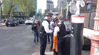 Citizen pushes over oil activists, before being arrested by the police