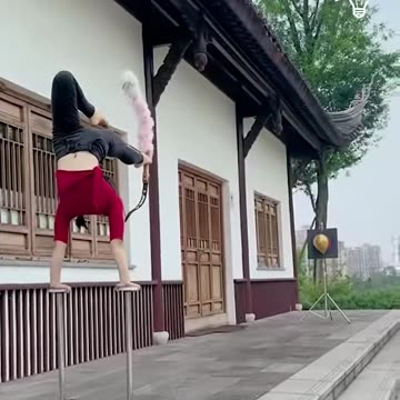 Girl shooting bow with her feet!