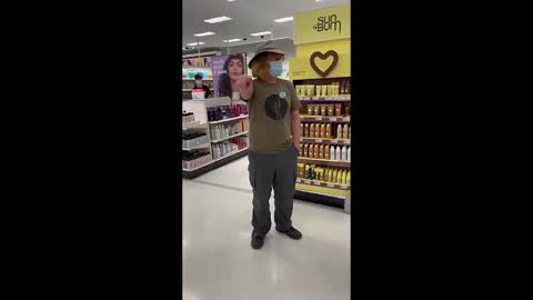 Man With "Vaccinated" Badge Follows Woman Around Store To Put Her Mask On