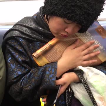 Woman cuddles and caresses book