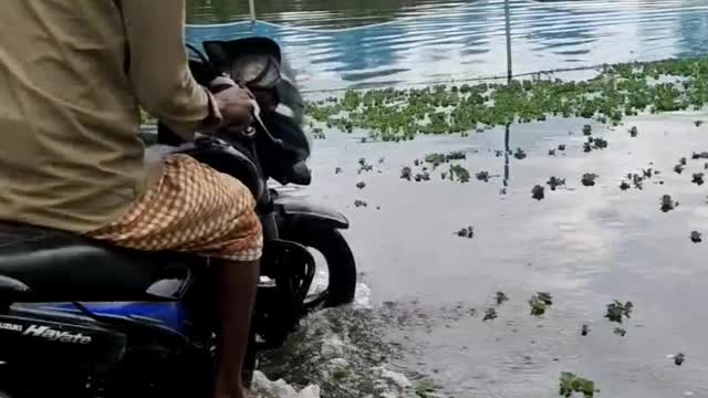 Water in ride motorbike. flood effect by road. Motorcycle ride on water. very watar on road