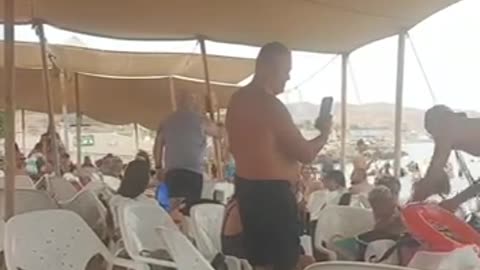 People at the beach in Eilat are celebrating the rescue of the hostage upon after
