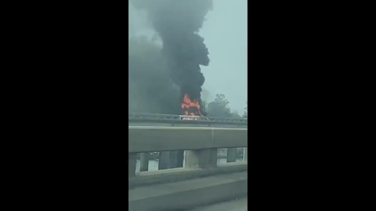 A vehicle on fire on the Bonnet Carre following a helicopter crash