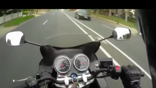 Biker wipes out in traffic!