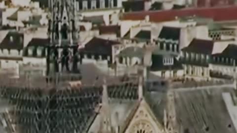 Black Clad Figure on Notre Dame roof lighting devices minutes before fire