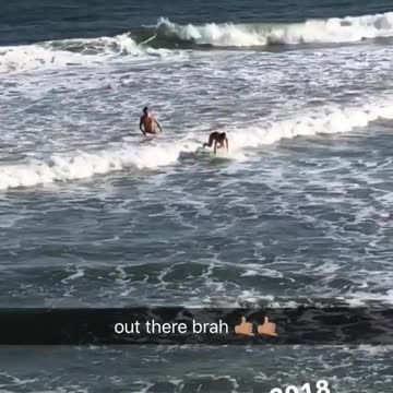 Two guys surfing small waves green board