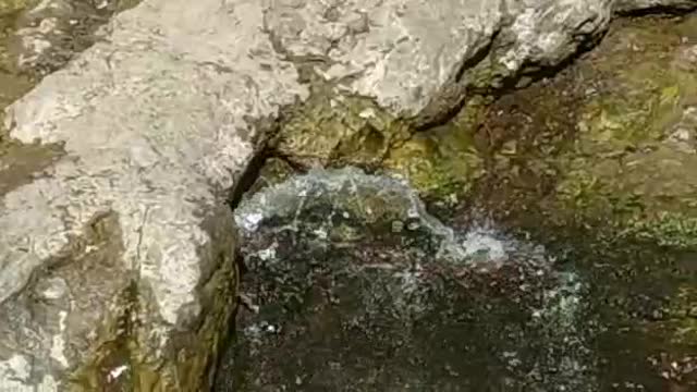 Water coming out from big stone😍