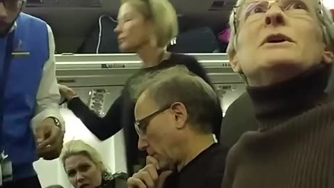 Angry Liberal upset at a Trump supporter removed from a plane