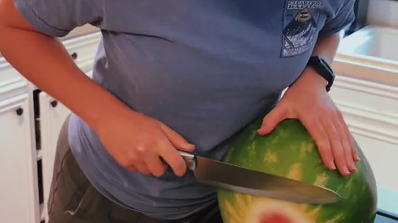 Slicing A Melon With A Melon-Slicer