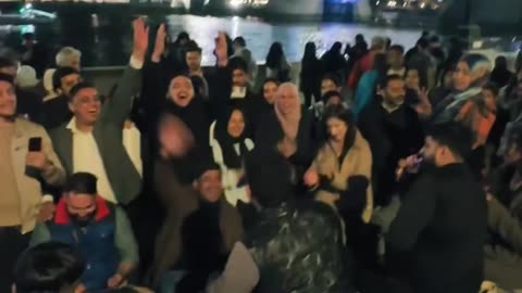 Immigrants are shouting and singing on London Bridge, which is visited by