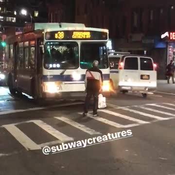 Man stands in front of b38 bus