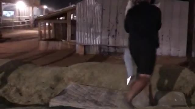 Guy falls off hay while trying to grab rope