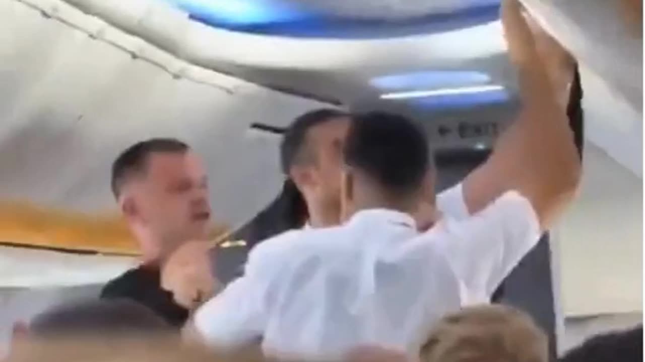 Riotous moment brawling passenger is served instant karma after slapping a steward in the face during mid-flight punch up on Ryanair flight to Tenerife