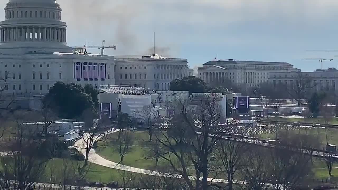 Smoke behind Capitol. People Running from the inauguration stage