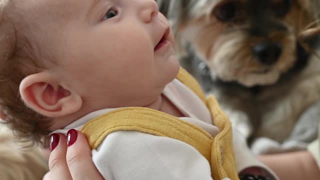 woman playing with cute smiley baby