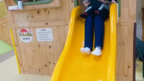 The slide of the father and the baby