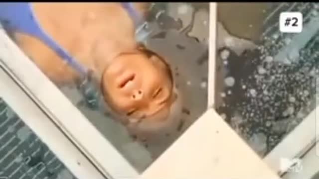 In a competition program, a couple was challenged to try to get out of a cage filled with water