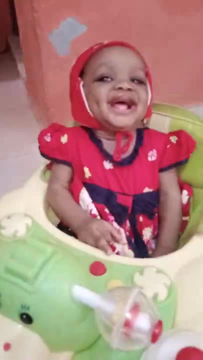 Baby riding herself on her walker