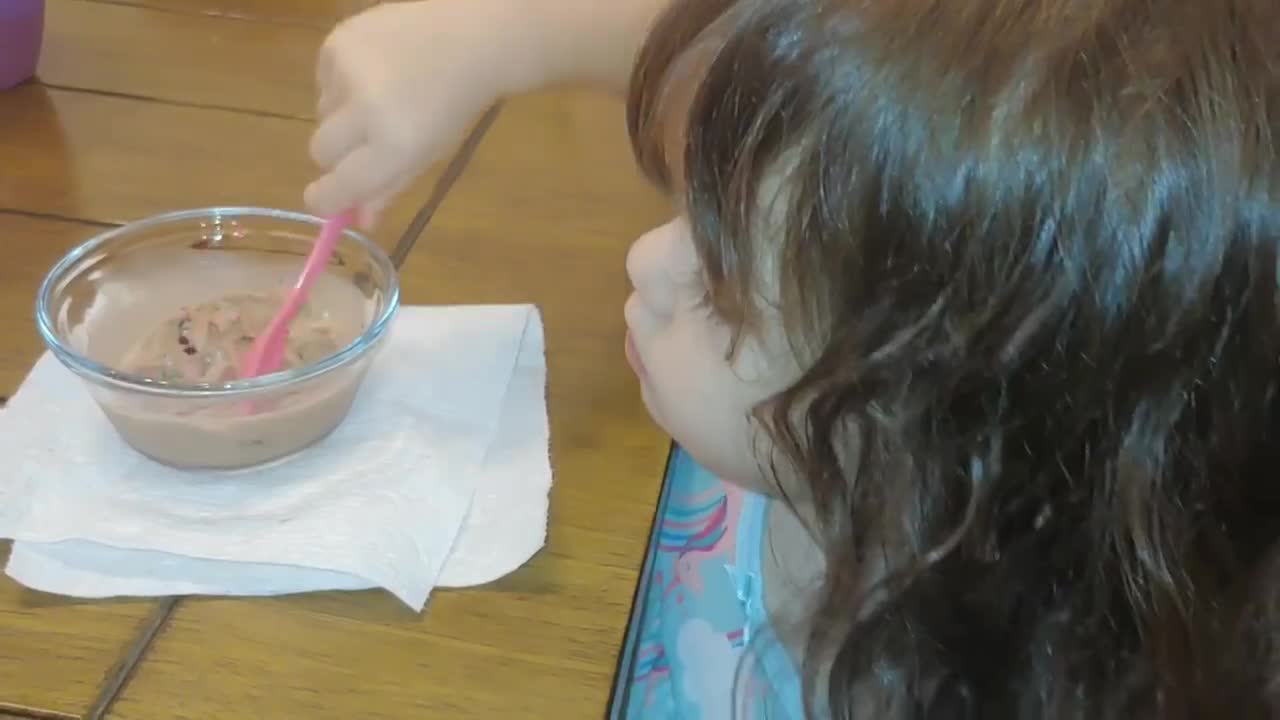 Trying her ice cream