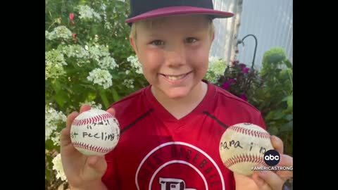 Boy signs first homerun ball for his grandpa