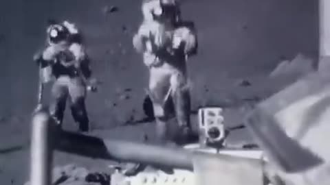 Sped up footage of astronauts jumping and tripping on the moon