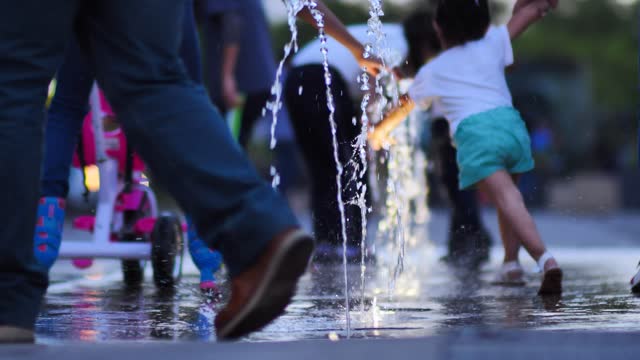 Dancing child with water