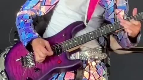 Corey Feldman "plays" guitar?