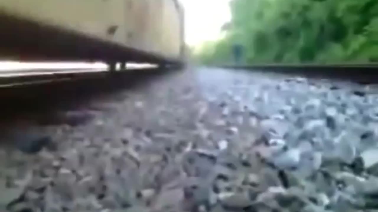 Dude stuck under a moving train escapes between its rails 😳