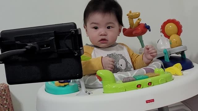 cute baby talking while watching