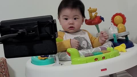 cute baby talking while watching