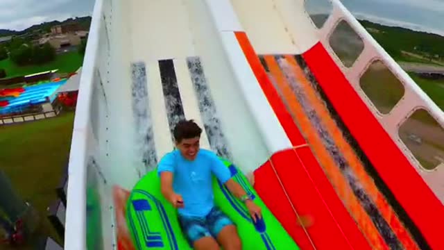 Racing on the world's first ever Blasterango Battle water slide!