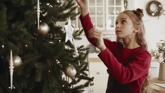 Little girl near the Christmas tree