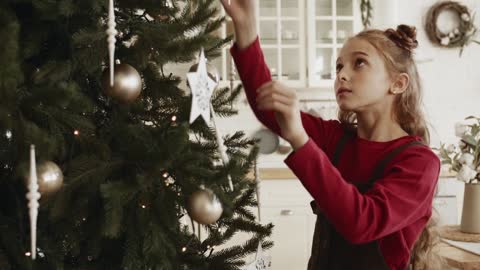 Little girl near the Christmas tree