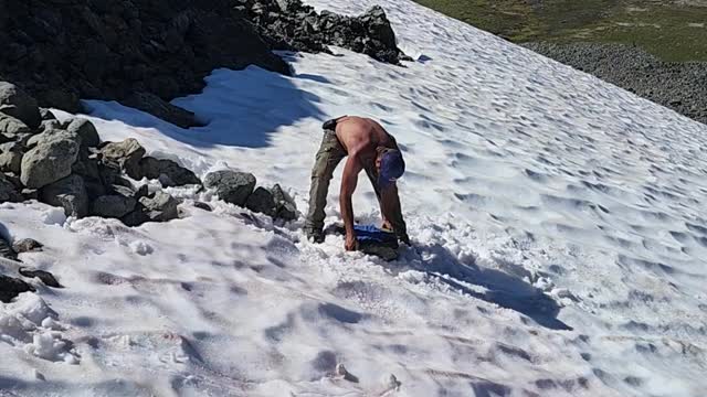 Sliding downtown on a rock