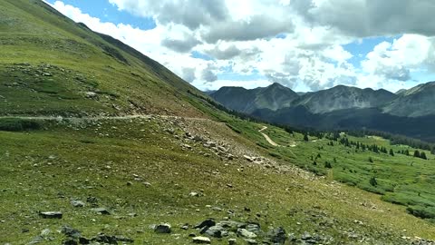 Mountain bike riding up Tin Cup Pass