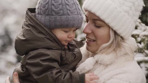 a-woman-kissing-and-playing-with-her-baby