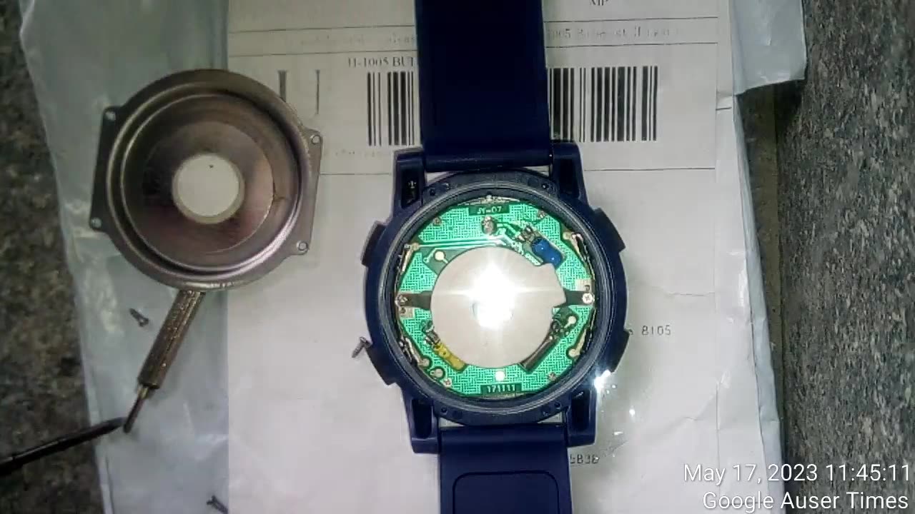 Pickup of the planted by police broken used watch at the postal office May 18th 2023