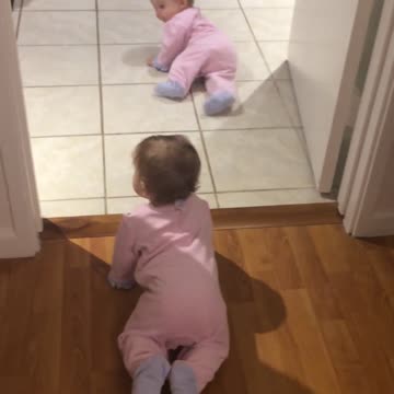 Identical twin baby girls crawl and chase each other for the first time