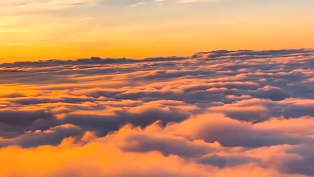 The mountains rose above a swathe of thick cloud.