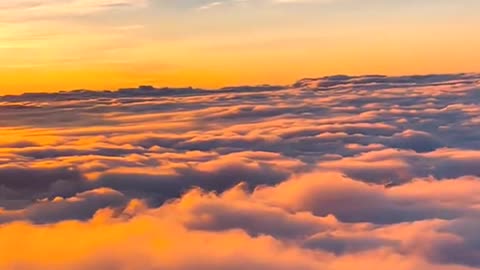 The mountains rose above a swathe of thick cloud.